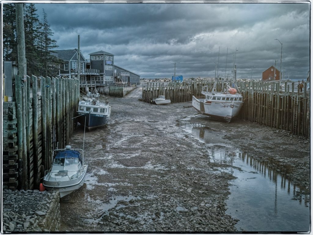 Low tide and a dreary day at Hall's Harbour, Nova Scotia, with the boats on the ground. 